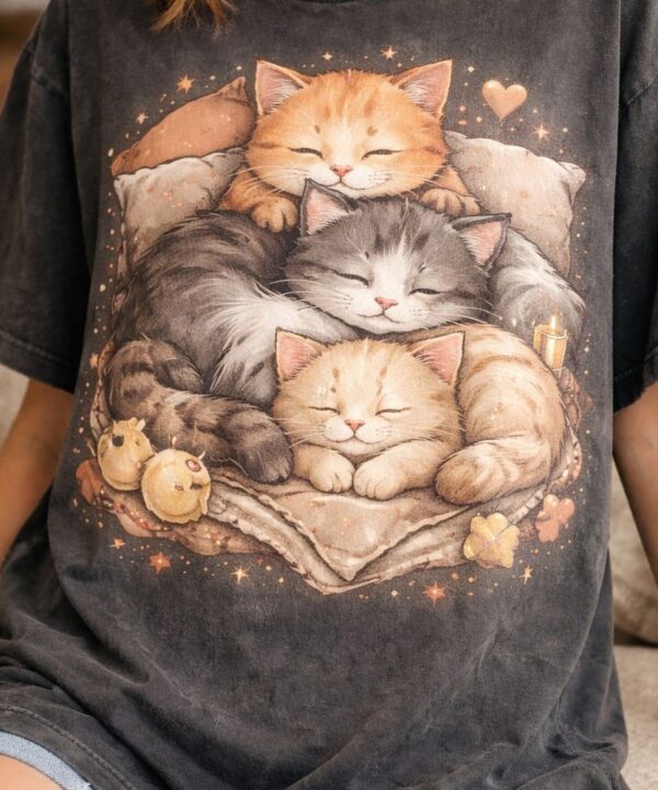 Cozy cat trio on a T-shirt