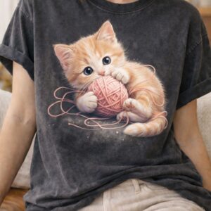 Kitten playfulness on vintage T-shirt