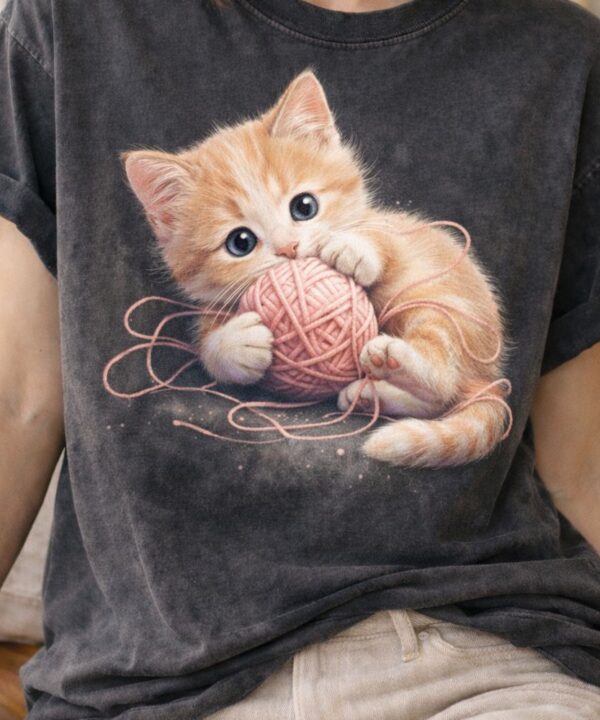 Kitten playfulness on vintage T-shirt